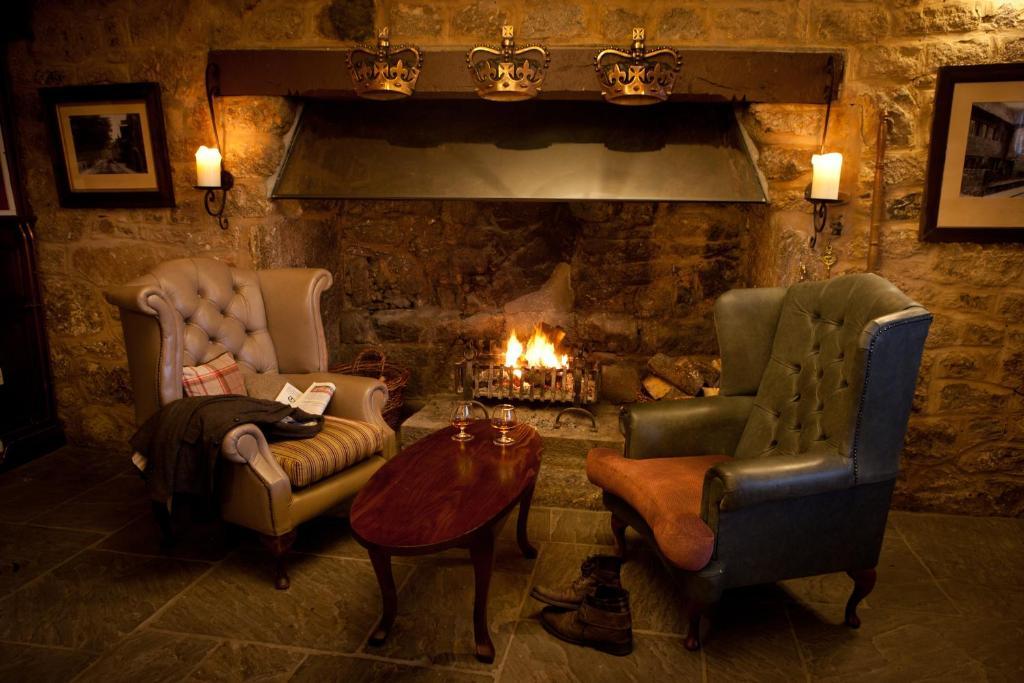 The Three Crowns Hotell Chagford Exteriör bild The fireplace in the bar